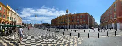 a group of people walking around a city street at Royal Studio Massena in Nice