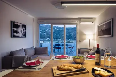 a living room with a table with food on it at Appartement in Carros