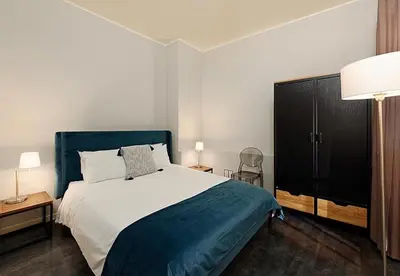 a bedroom with a large bed with a blue headboard at #18 Rossetti Suite 2 Bedrooms , Central Old Nice/AC in Nice