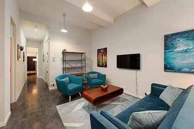 a living room with a blue couch and chairs at #18 Rossetti Suite 2 Bedrooms , Central Old Nice/AC in Nice