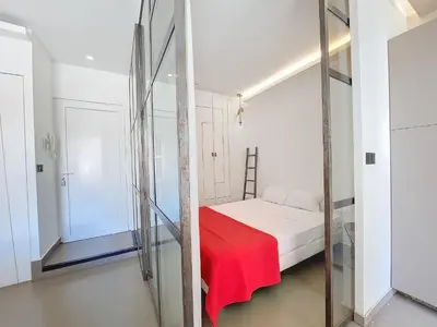 a bedroom with a bed with a red blanket on it at Nestor&Jeeves - COEUR DAZUR - Central - Modern in Nice