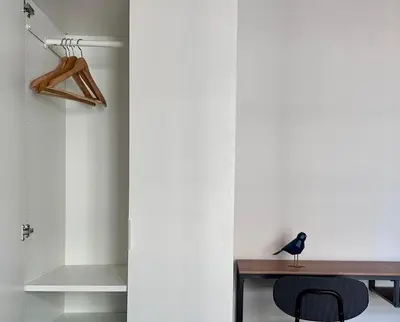 a bird sitting on a table in a room at Charmant appartement à Nice in Nice