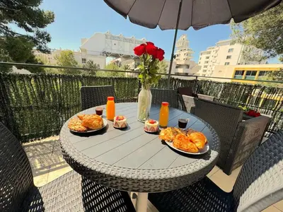 a kitchen with an open dishwasher with a sink at ⁂ Studio cosy 3 min de la plage terrasse clim in Nice