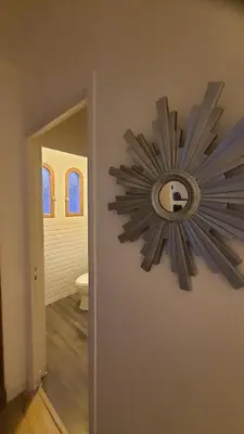 a clock on the wall of a bathroom at chez steph in La Trinité