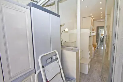 a bathroom with a mirror and a toilet in a room at Luxury Sea Front Condo Milord in Nice
