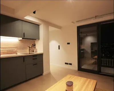 a kitchen with a table and a large window at Fully equiped newly refurbished studio with an incredible view in Nice in Nice
