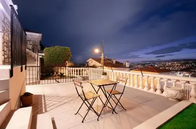 a patio with two chairs and a table on a balcony at Fully equiped newly refurbished studio with an incredible view in Nice in Nice