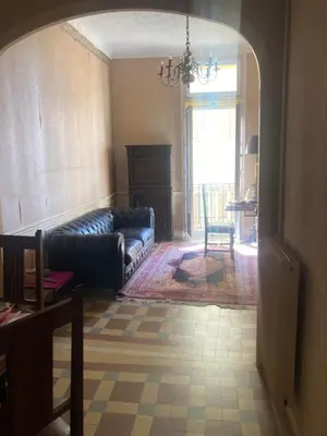 a living room with a couch and a table at Appartement dans le Vieux-Nice in Nice