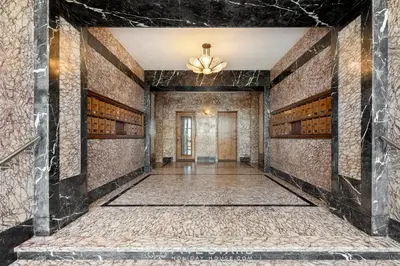 an empty hallway with brick walls and a ceiling at Suite Grand Sud FSHH in Nice