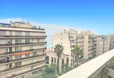 a view from the balcony of a building with palm trees at Nestor&Jeeves - LIFESTYLE - Terrace - Modern in Nice