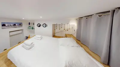 a bedroom with two beds in a room at Joli studio centre-ville Nice proche de la gare in Nice