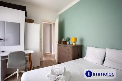 a bedroom with a bed and a desk and a chair at Apartment with 2 bedrooms Quartier Libération in Nice