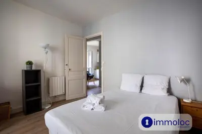 a bedroom with a white bed with towels on it at Apartment with 2 bedrooms Quartier Libération in Nice