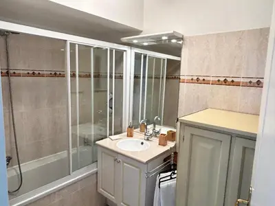 a bathroom with a sink and a shower at VUE mer 02 chambres 45M et parking in Nice