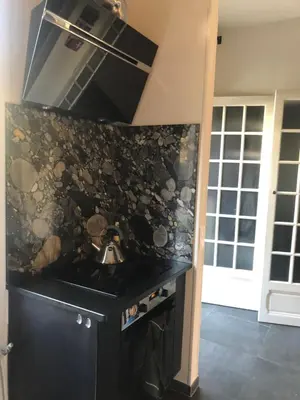 a kitchen with a black counter top and a stove at Villa Nice in Nice