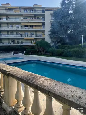 a swimming pool in front of a building at Studio à Nice - 10 min de la plage in Nice