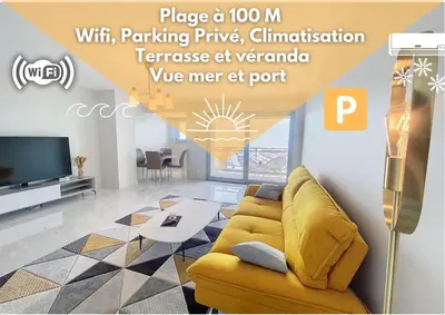 a living room with a yellow couch and a tv at Horizon bleu vue mer dernier étage clim in Saint-Laurent-du-Var