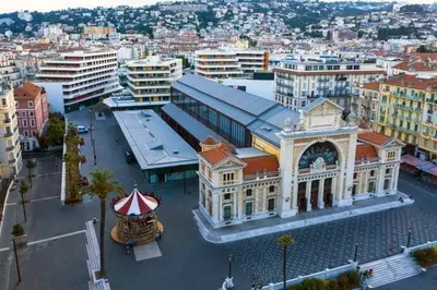 a large building with a circus tent in a city at Appartement Nice Libération in Nice