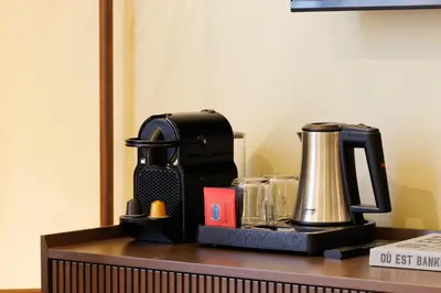 a coffee maker sitting on top of a table at Naomi Nice in Nice