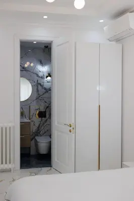 a bedroom with a bathroom with a wall mural at Appartement 3 PIECES NICE Promenade in Nice