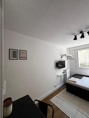 a white room with a bed and a window at Nice appartement for 2 adults with air-conditioning in Nice