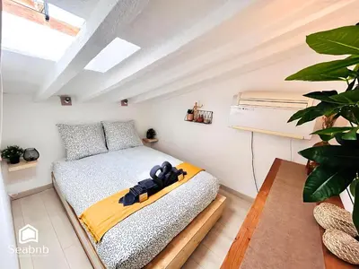 a bedroom with a bed with a yellow blanket at Little Nest - Old Town - Breakfast - Wifi - AC in Nice