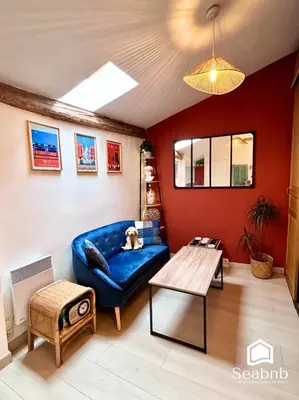 a living room with a blue couch and a table at Little Nest - Old Town - Breakfast - Wifi - AC in Nice