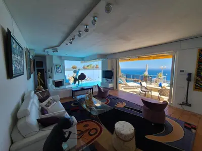 a living room with a view of the ocean at Eze sur mer - vue Saint Jean Cap Ferrat in Èze