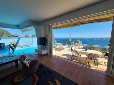 a living room with a view of the ocean at Eze sur mer - vue Saint Jean Cap Ferrat in Èze