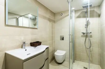 a bathroom with a toilet and a sink and a shower at Cocon au cœur du Vieux Nice in Nice
