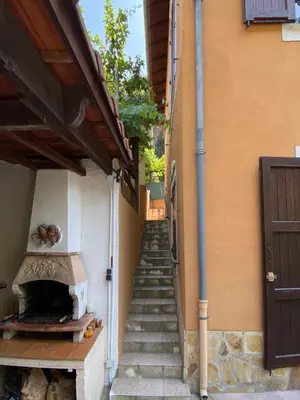 a stairway leading up to a building with a oven at Villa Serenice - F2 au calme, climatisé, WIFI et parking gratuit in Nice