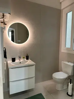 a bathroom with a white sink and a toilet at Studio Cosy à Nice Centre in Nice