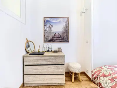 a dresser in a bedroom with a picture on the wall at CENTRE VILLE - SUPERBE APPARTEMENT CLIMATISE - COSY-Wifi - in Nice