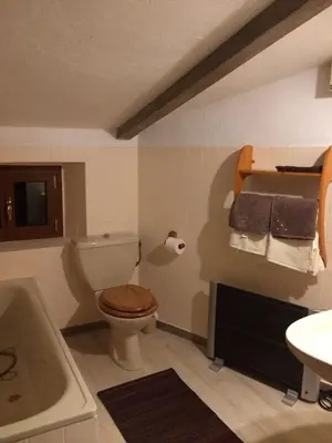 a bathroom with a toilet and a sink and a tub at Maison de caractère in Saint-Jeannet