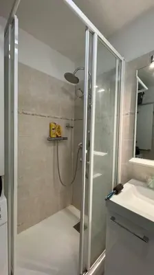 a bathroom with a shower and a sink and a shower at Nice Proche Mer in Nice