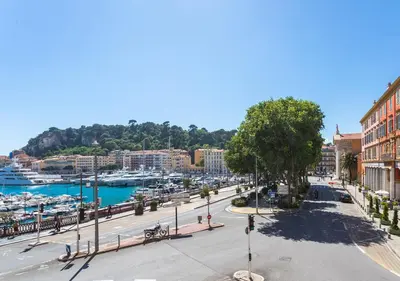 a street in a city with a marina at PORT CARNOT AP4405 By Riviera Holiday Homes in Nice