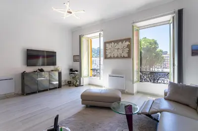 a living room with a couch and a tv at PORT CARNOT AP4405 By Riviera Holiday Homes in Nice