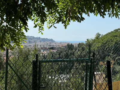 a fence with a view of a city at Art Studio Nice in Nice