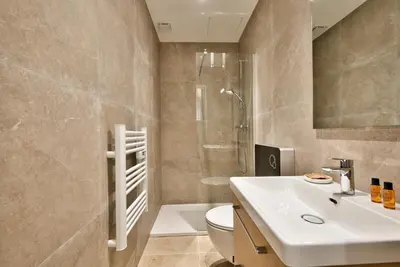 a bathroom with a sink and a toilet and a shower at Cosy Apparts Hypercentre de Nice in Nice