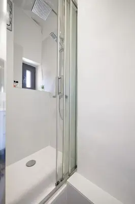 a shower with a glass door in a bathroom at Magnifique 3 pièces de 80m2 dans le Carré d'Or in Nice