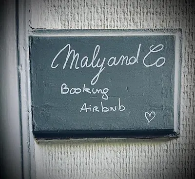 a sign on a wall that says ally and egoboardingitzamicamicamicamic at Malyandco in Nice