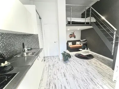 a kitchen and living room with a loft at Malyandco in Nice