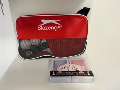 a box with a tennis racket and two playing cards at Studio piscine climatisation tennis in Nice
