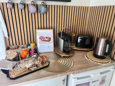 a counter top with food and appliances on it at LOVE ROOM Tente chauffée Lodge spa MFG chez C&C, exclusivement réservée aux ADULTES in Cantaron