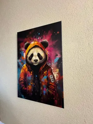 a painting of a panda bear wearing a jacket at Appartement en duplex in Nice