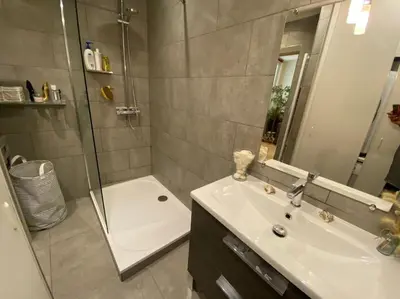 a bathroom with a shower and a sink and a tub at 2 pièces Vieux Nice - Deux pas de la mer in Nice