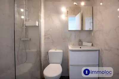 a bathroom with a toilet and a sink and a shower at Studio Air-conditioned district of the Musicians in Nice