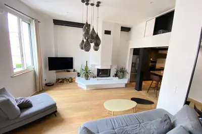 a living room with a couch and a table at 06BX Loft Pessicart in Nice
