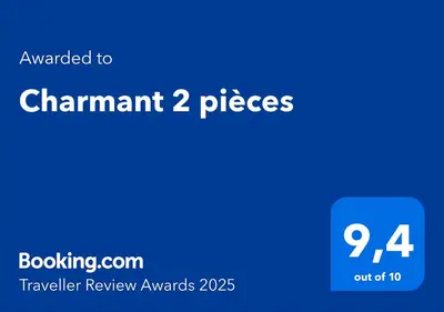 a blue screen with the text awarded to channel pieces at Charmant 2 pièces in Nice