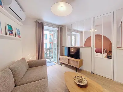 a living room with a couch and a tv at Nestor&Jeeves - PLACE DU PIN - Near Port - Old town in Nice